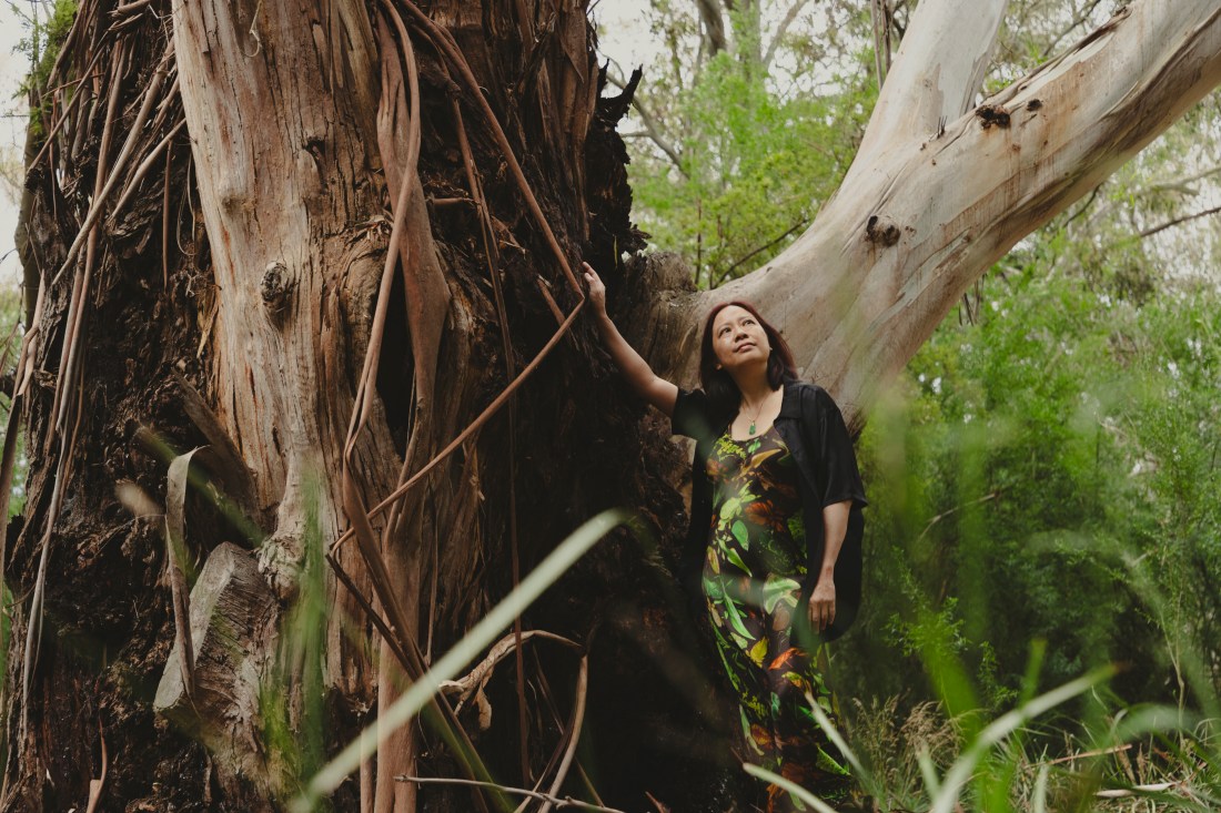 Portrait photo of Liza Lim in bushland garden, (c) Fiona Wolf, Heide MOMA, Jan 2026